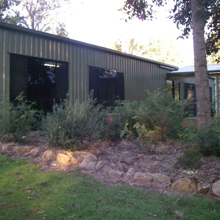 Self-contained cattery building surrounded by gardens