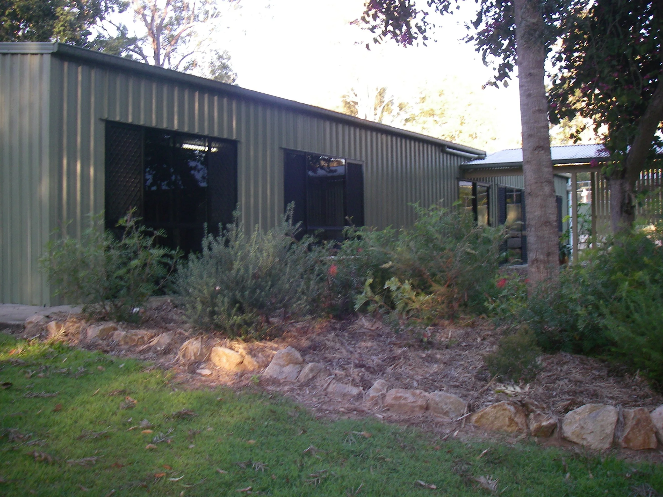 Self-contained cattery building surrounded by gardens